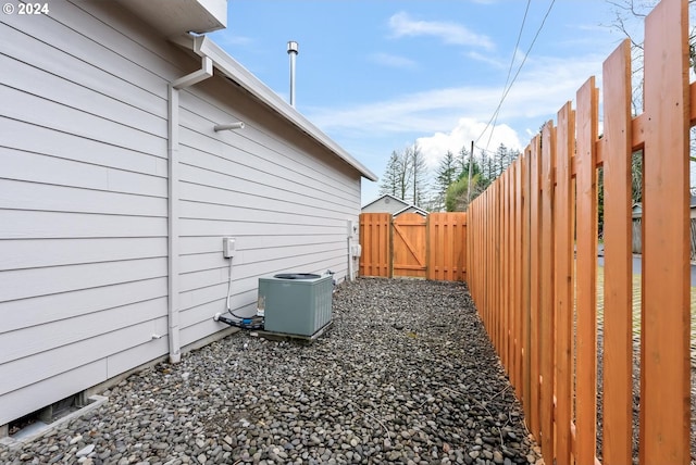 view of side of home featuring cooling unit