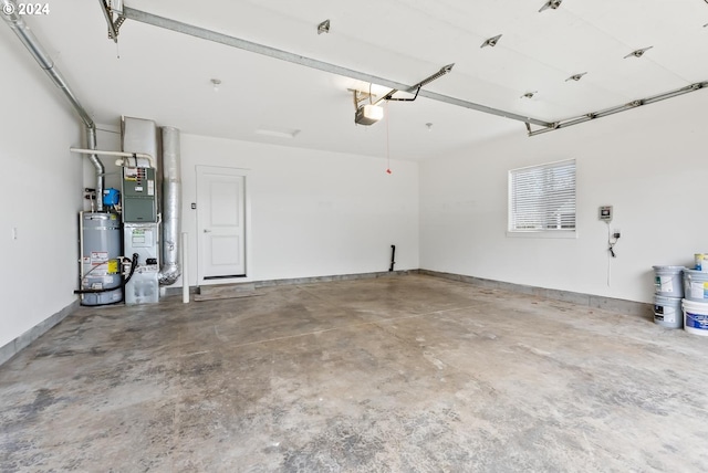 garage featuring water heater and a garage door opener