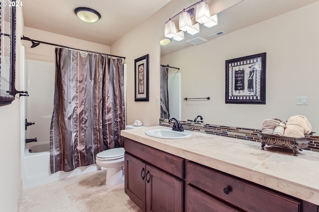 full bathroom featuring shower / bathtub combination with curtain, vanity, and toilet