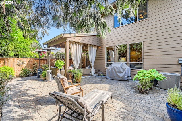 view of patio / terrace with cooling unit and grilling area