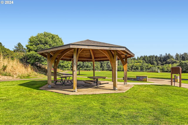 surrounding community featuring a gazebo and a yard