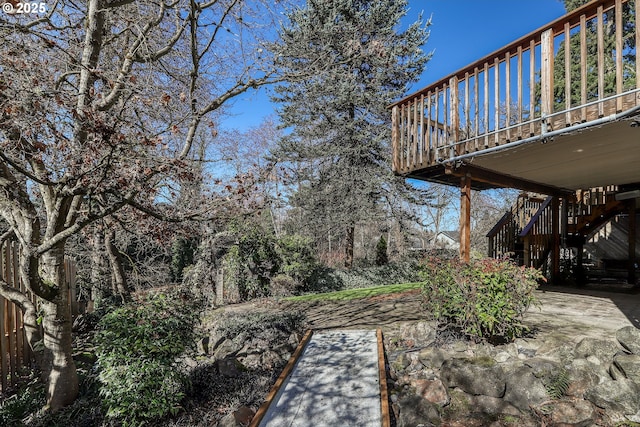 view of yard with a patio and stairway