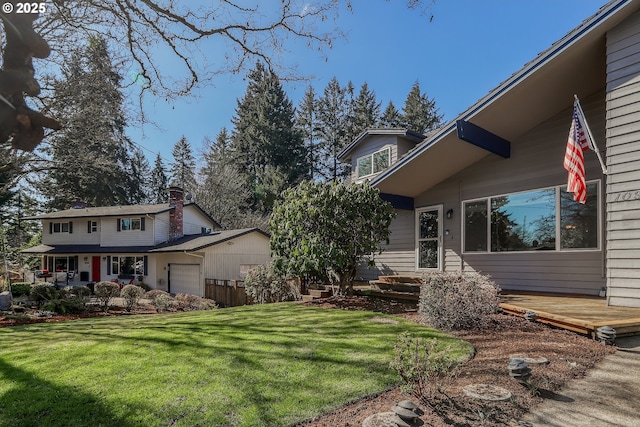 exterior space with a garage and a front yard