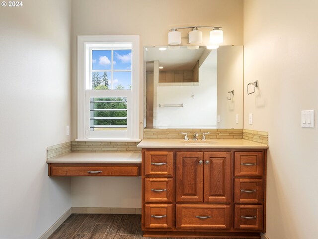 bathroom featuring hardwood / wood-style flooring and vanity