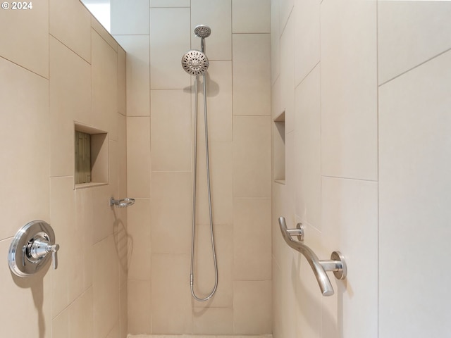 bathroom featuring tiled shower