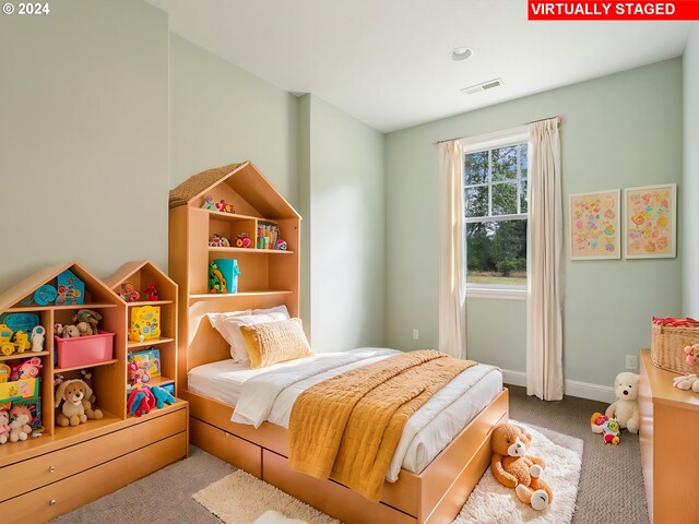 bedroom with light carpet