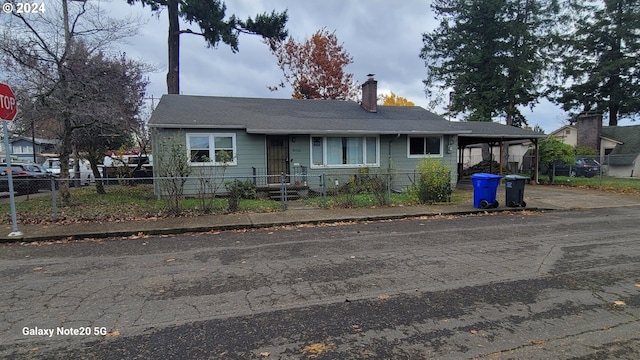 view of front of home featuring a carport