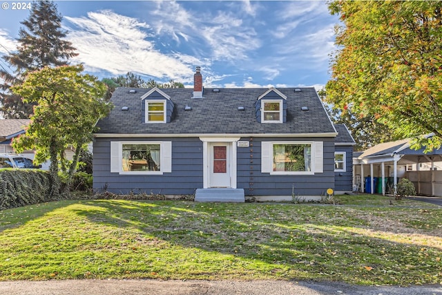 new england style home featuring a front lawn