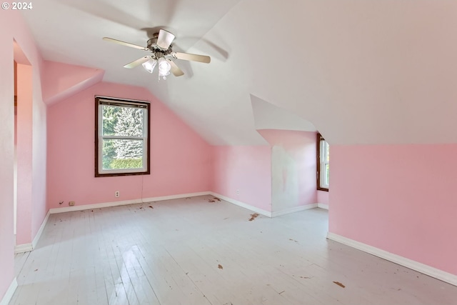 bonus room featuring light hardwood / wood-style floors, lofted ceiling, and ceiling fan