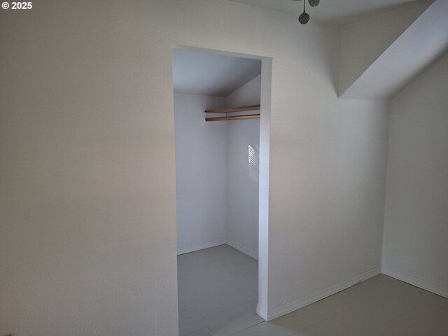 bonus room featuring light hardwood / wood-style flooring, ceiling fan, and vaulted ceiling