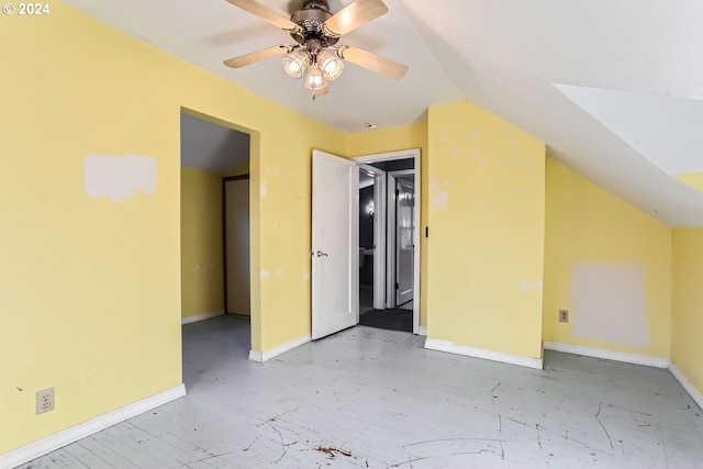 additional living space featuring ceiling fan and lofted ceiling