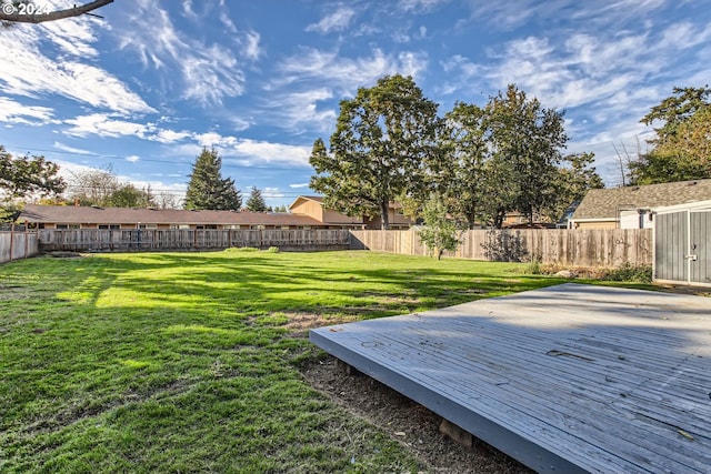 view of yard with a wooden deck