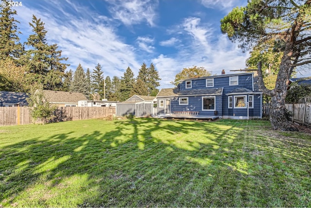 exterior space featuring a yard and a wooden deck