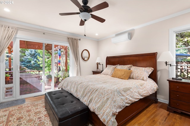 bedroom with ornamental molding, light wood-type flooring, access to outside, and a wall unit AC