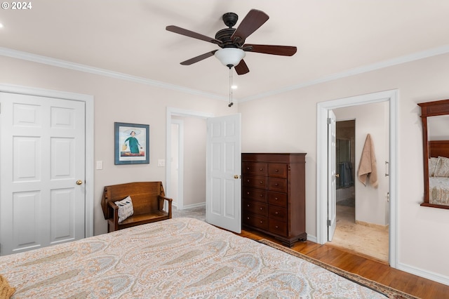 bedroom featuring crown molding, ceiling fan, and light wood-type flooring