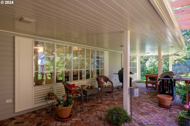 view of patio / terrace with a grill and covered porch