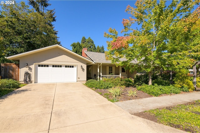 single story home featuring a garage and covered porch