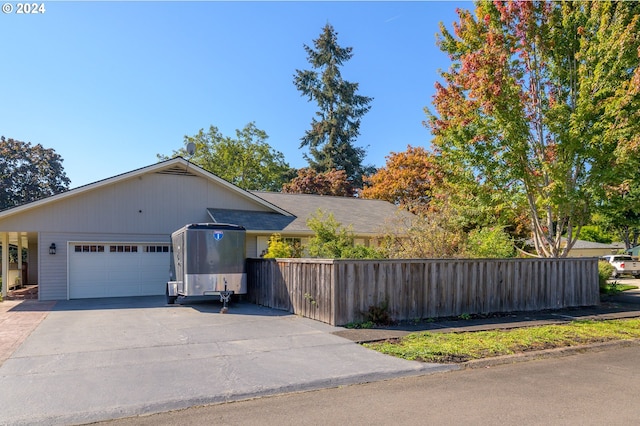 view of side of property with a garage