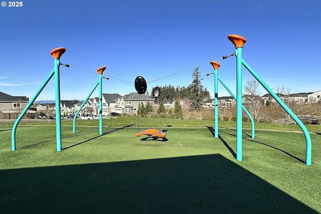 view of playground with a lawn