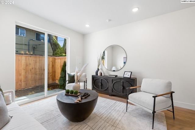 living area with light hardwood / wood-style flooring