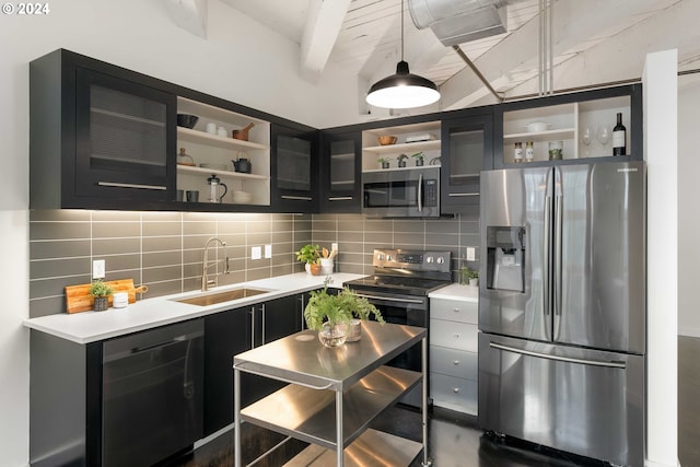 kitchen with appliances with stainless steel finishes, hanging light fixtures, decorative backsplash, beamed ceiling, and sink