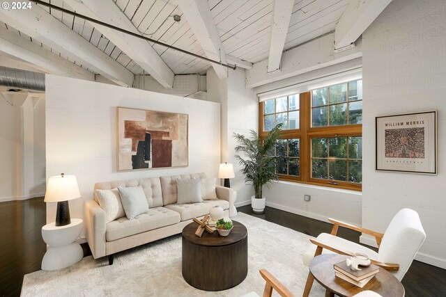 living room featuring vaulted ceiling with beams, wood-type flooring, and wooden ceiling