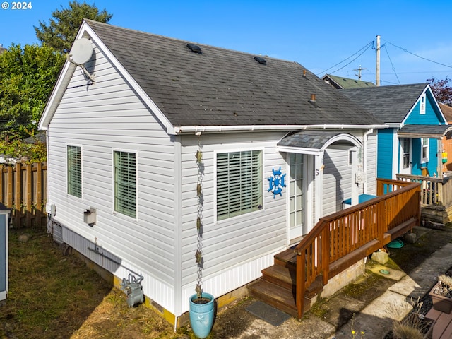 back of house featuring a deck