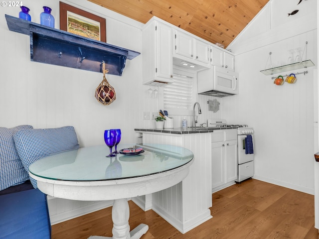 kitchen featuring wood ceiling, lofted ceiling, white cabinetry, hardwood / wood-style flooring, and white appliances