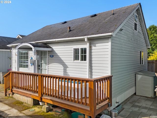 rear view of house with a deck