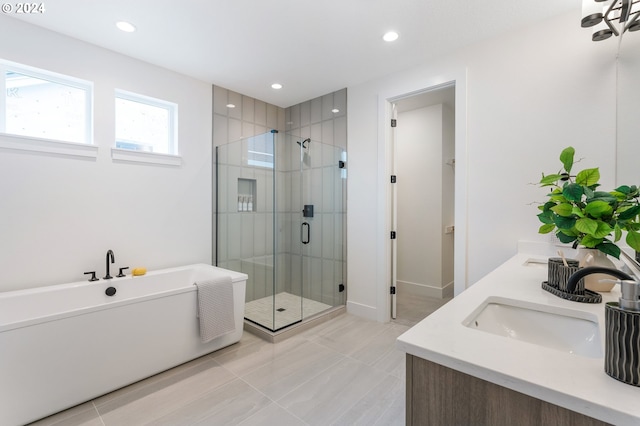 bathroom featuring vanity, tile patterned floors, and separate shower and tub