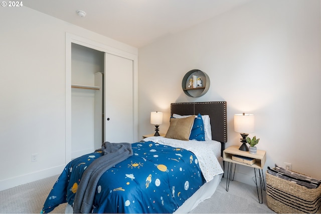 carpeted bedroom featuring a closet