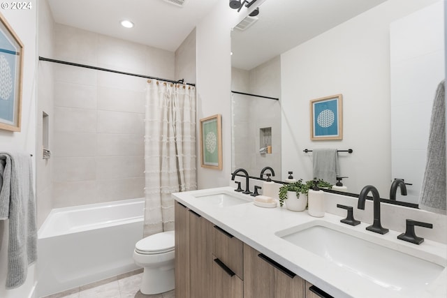 full bathroom featuring vanity, shower / tub combo with curtain, toilet, and tile patterned floors