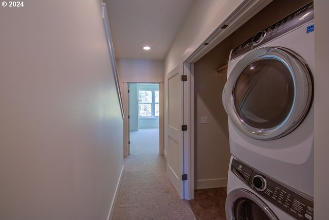 washroom featuring carpet, baseboards, laundry area, recessed lighting, and stacked washer / drying machine