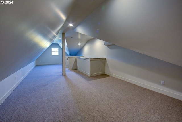 bonus room with light carpet, recessed lighting, baseboards, and lofted ceiling