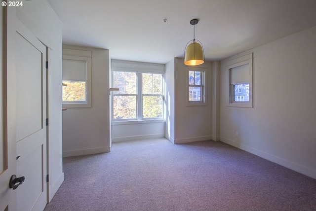 spare room with light colored carpet