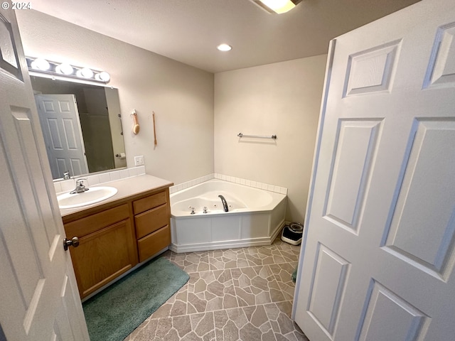 146 28th St, Long Beach, WA 98631 - bathroom featuring vanity, a whirlpool tub, and recessed lighting