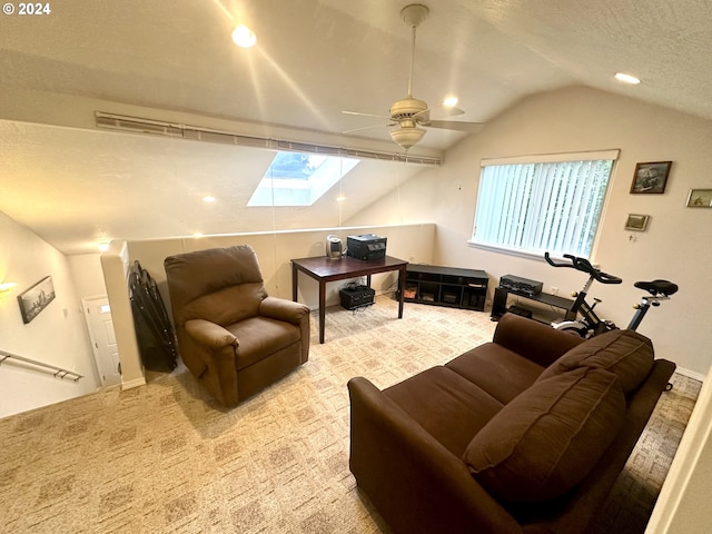146 28th St, Long Beach, WA 98631 - carpeted living room featuring lofted ceiling, ceiling fan, a textured ceiling, recessed lighting, and a skylight