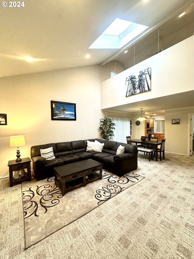 146 28th St, Long Beach, WA 98631 - carpeted living area with a skylight, high vaulted ceiling, and baseboards