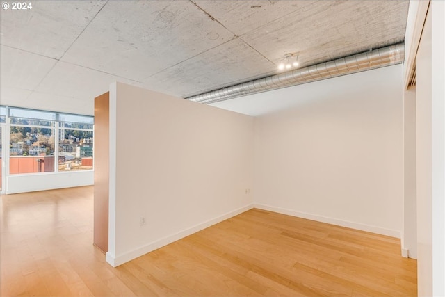 empty room featuring wood-type flooring