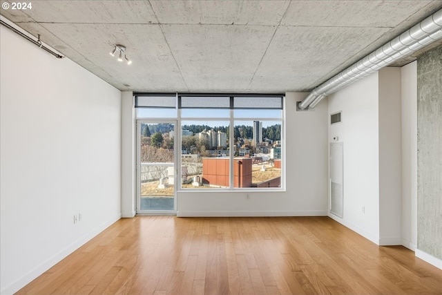 spare room featuring light hardwood / wood-style floors