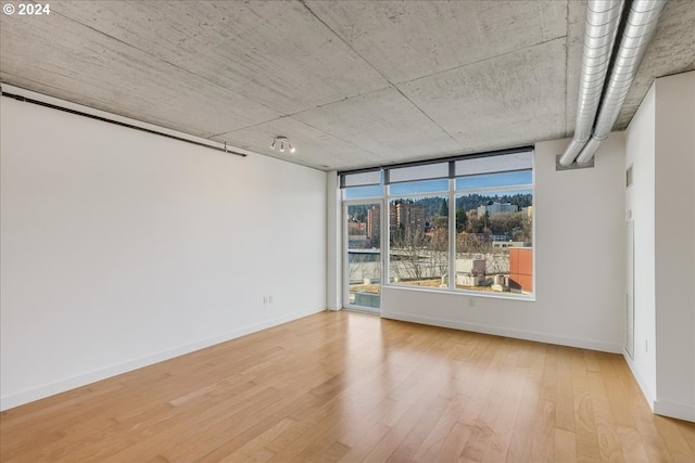 spare room featuring light hardwood / wood-style floors