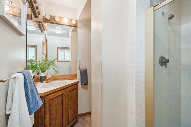 full bath with a stall shower and vanity