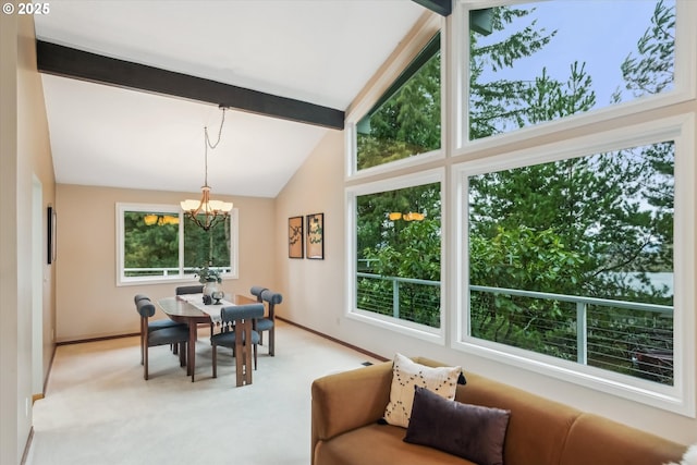 dining area with light carpet, vaulted ceiling with beams, a wealth of natural light, and an inviting chandelier