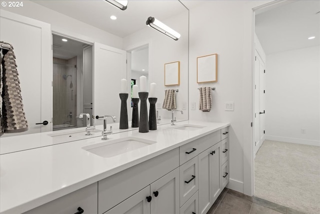 bathroom with vanity and a shower