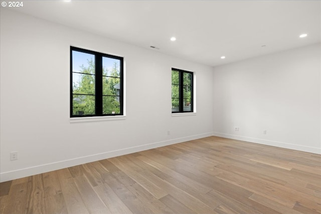 spare room with light hardwood / wood-style floors