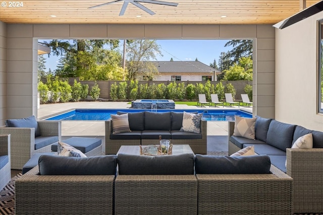 view of swimming pool featuring outdoor lounge area, ceiling fan, and an in ground hot tub