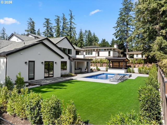 back of house with a gazebo, a yard, an outdoor hangout area, and a patio