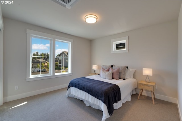 bedroom with light carpet