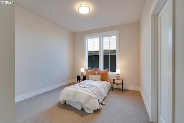 bedroom with light colored carpet