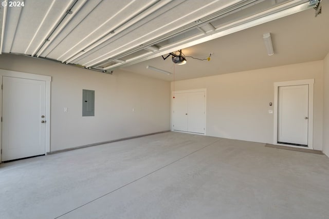 garage with electric panel and a garage door opener